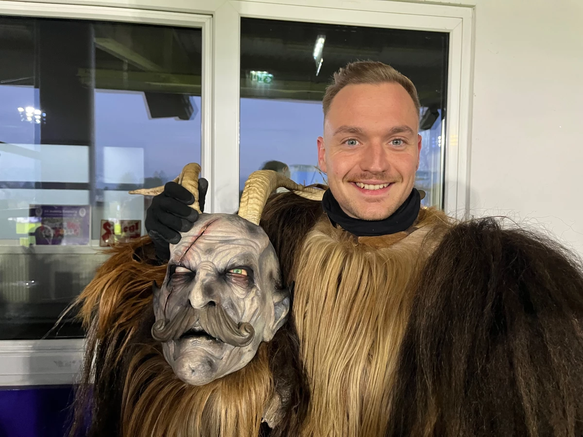 Roy Huber, from Bavaria, holds his Krampus mask prior to the Krampus Run. 'When the winter comes, you get the feeling to be Krampus,' he says.