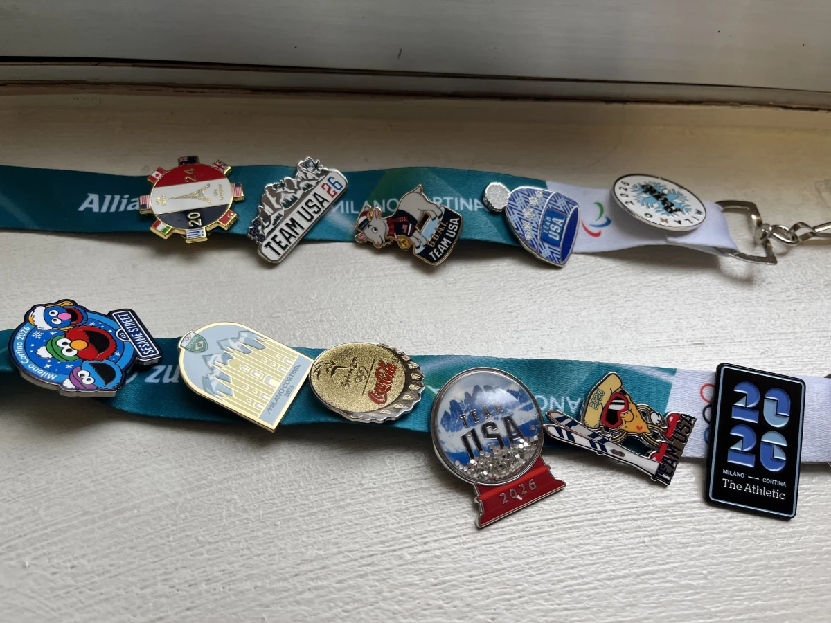 This reporter's collection of pins, amassed over nearly three weeks in exchange for NPR buttons. The Team USA snowglobe (with real glitter) and skiing pizza have been big conversation starters.
