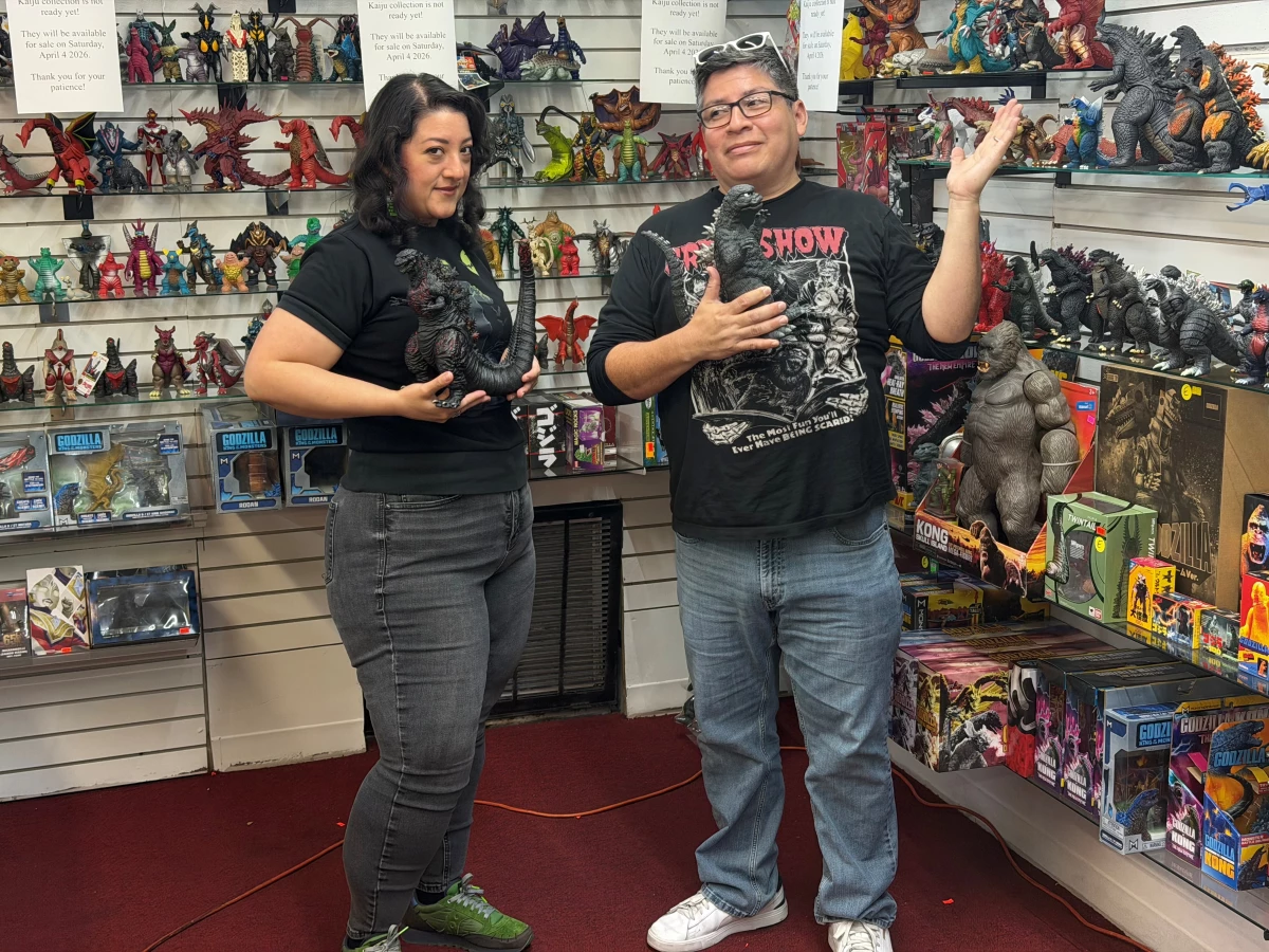 Paulina Gamino and Daniel Rivera of Houston's Misfit Toys display some of their latest vintage toy purchases, a collection of Godzilla action figures.