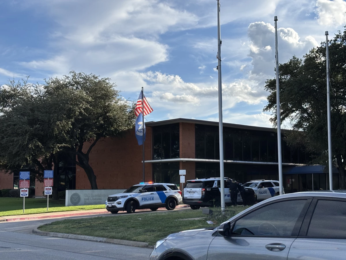 Law enforcement agents secure an immigration facility in Dallas on Sept. 24, 2025 after a gunman shot at the facility, killing two detainees and injuring a third one.