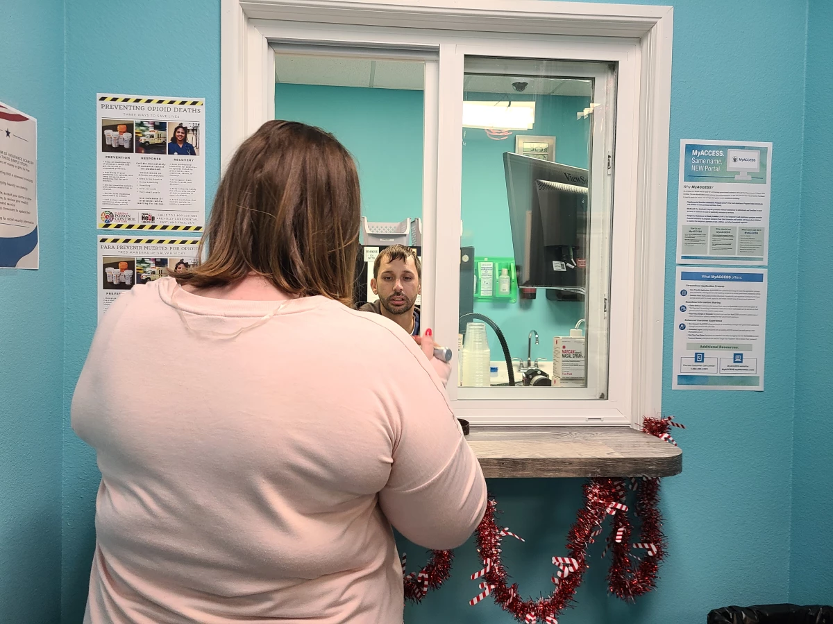 Stephanie, who asked that only her first name be used, picks up her methadone prescription at the Operation PAR clinic in Inverness, Florida.