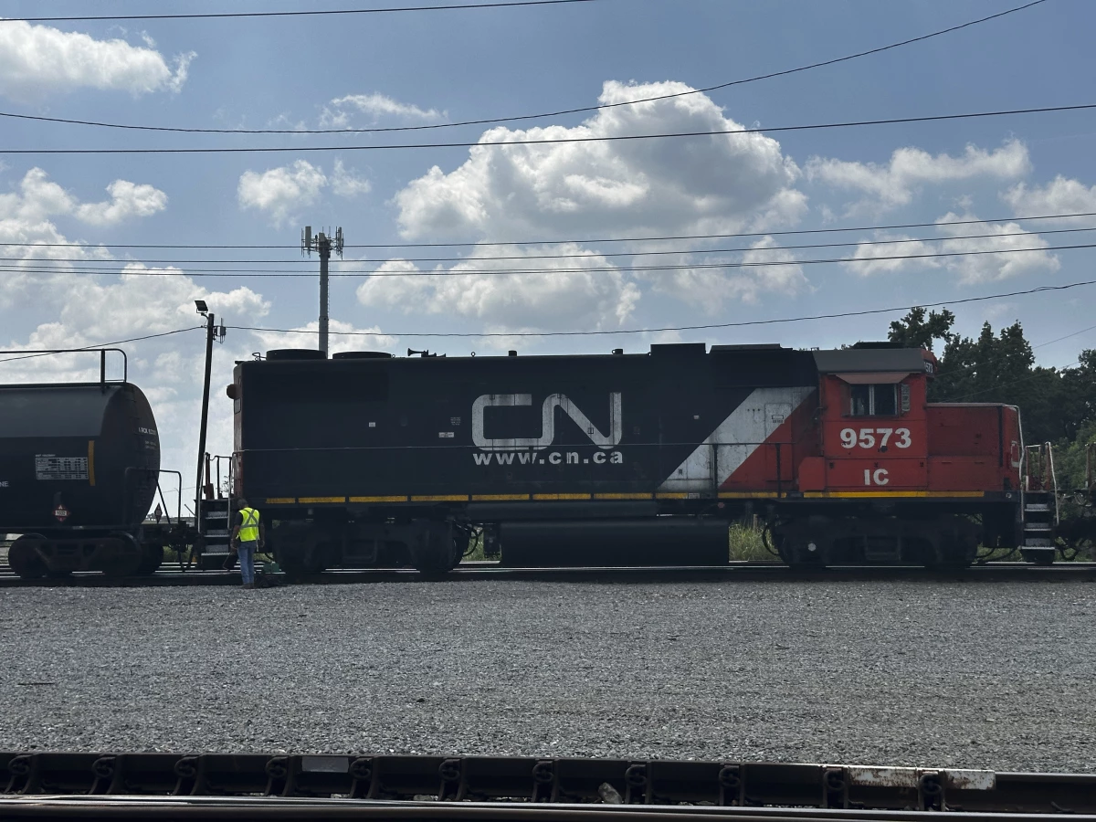 A railwayman inspects the locomotive of a Canadian National Railroad train, Thursday, Aug. 22, 2024 in Metairie, La.