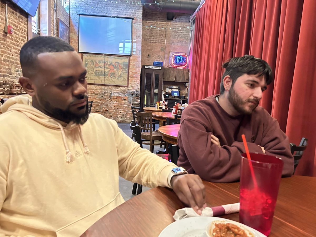 Adrian Consonery, Jr., and Brian Ramirez were part of a group of grassroots organizers that NPR met with at Manuel's Tavern in Atlanta on Oct. 22, 2024.