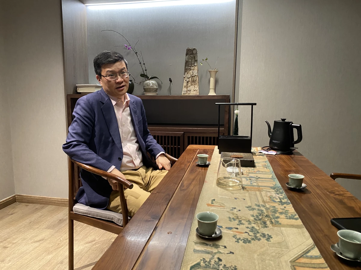 Da Wei, director of the Center for International Security and Strategy (CISS) at Tsinghua University, sits for an interview with NPR on March 24 at Linxi Tea House in Beijing. He says China stands to gain from some of the Trump administration's foreign policy actions.