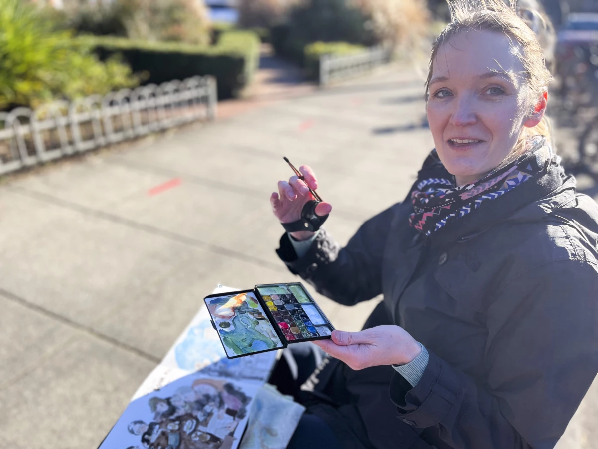Karen Hansen, who discovered Urban Sketchers last year, came prepared with a folding chair and a magnetic watercolor paint palette, so she could pop in the colors she wanted to use for today's painting.