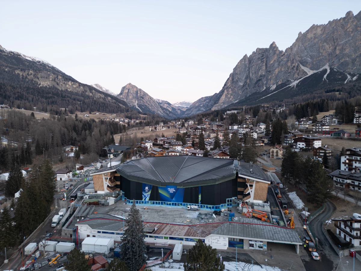 An aerial view of the Olympic Ice Stadium (Stadio Olimpico del Ghiaccio) during a phase of massive structural renovation for the Milano Cortina 2026 Winter Olympics