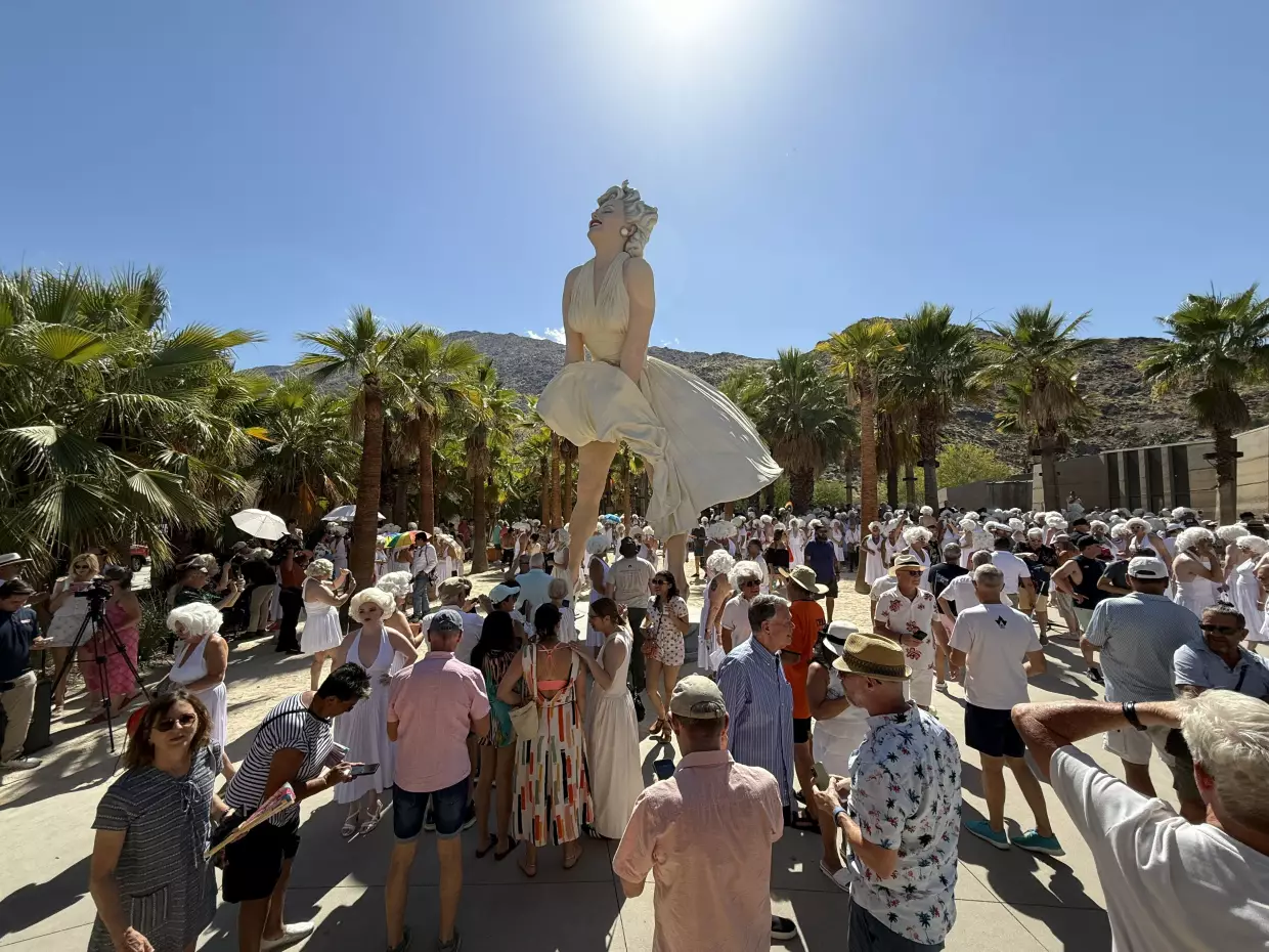 Marilyn Monroe lookalikes gather near the Marilyn Forever statue in downtown Palm Springs.