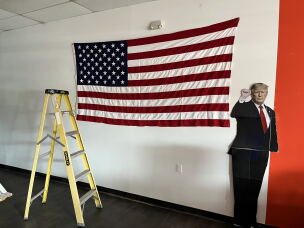A life-sized cardboard cutout of President Trump is propped up in the Aroostook County Republican headquarters in Caribou, Maine.