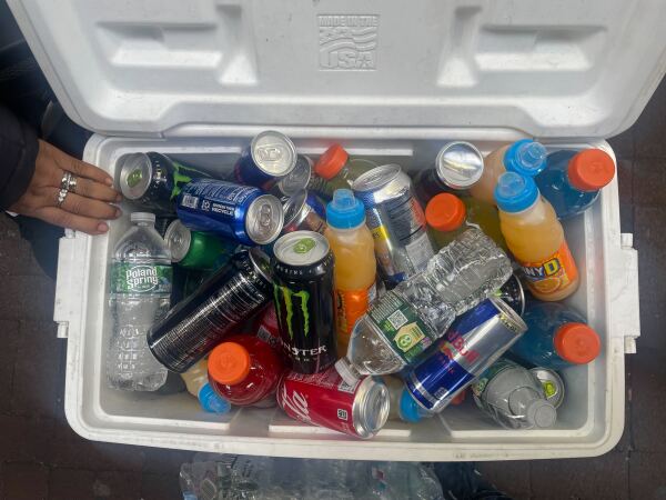 A street vendor in Queens stands near her cooler of drinks. She worries about the Trump administration's threats of increased ICE operations in New York City.
