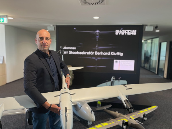 Quantum Systems’ chief sales officer, Martin Karkour, holds one of his company’s bestselling drones, the Vector, at the company’s headquarters outside Munich.