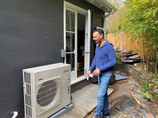 James Tucker with an efficient heat pump for his home near Oakland, Calif. Many states, cities, and utilities have additional heat pump incentives.