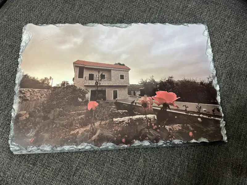 Farah's 75-year-old father missed seeing his home so much that Mazen mounted a photo of it on a stone plaque.