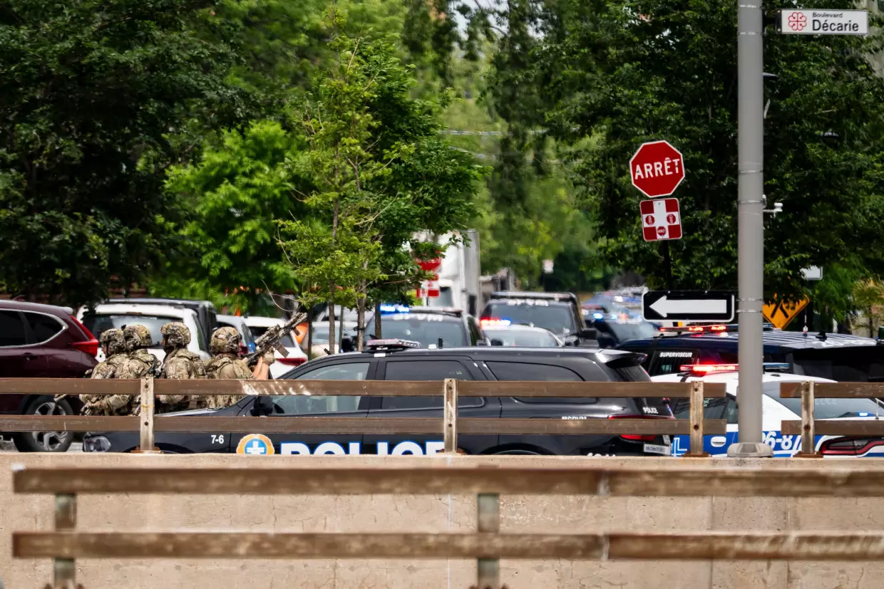 Montreal police work the scene of a shooting in Montreal on Monday, June 22, 2026.