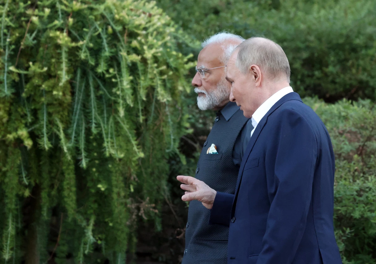 Russian President Vladimir Putin and Indian Prime Minister Narendra Modi take a walk during an informal meeting at the Novo-Ogaryovo state residence, outside Moscow, on July 8.