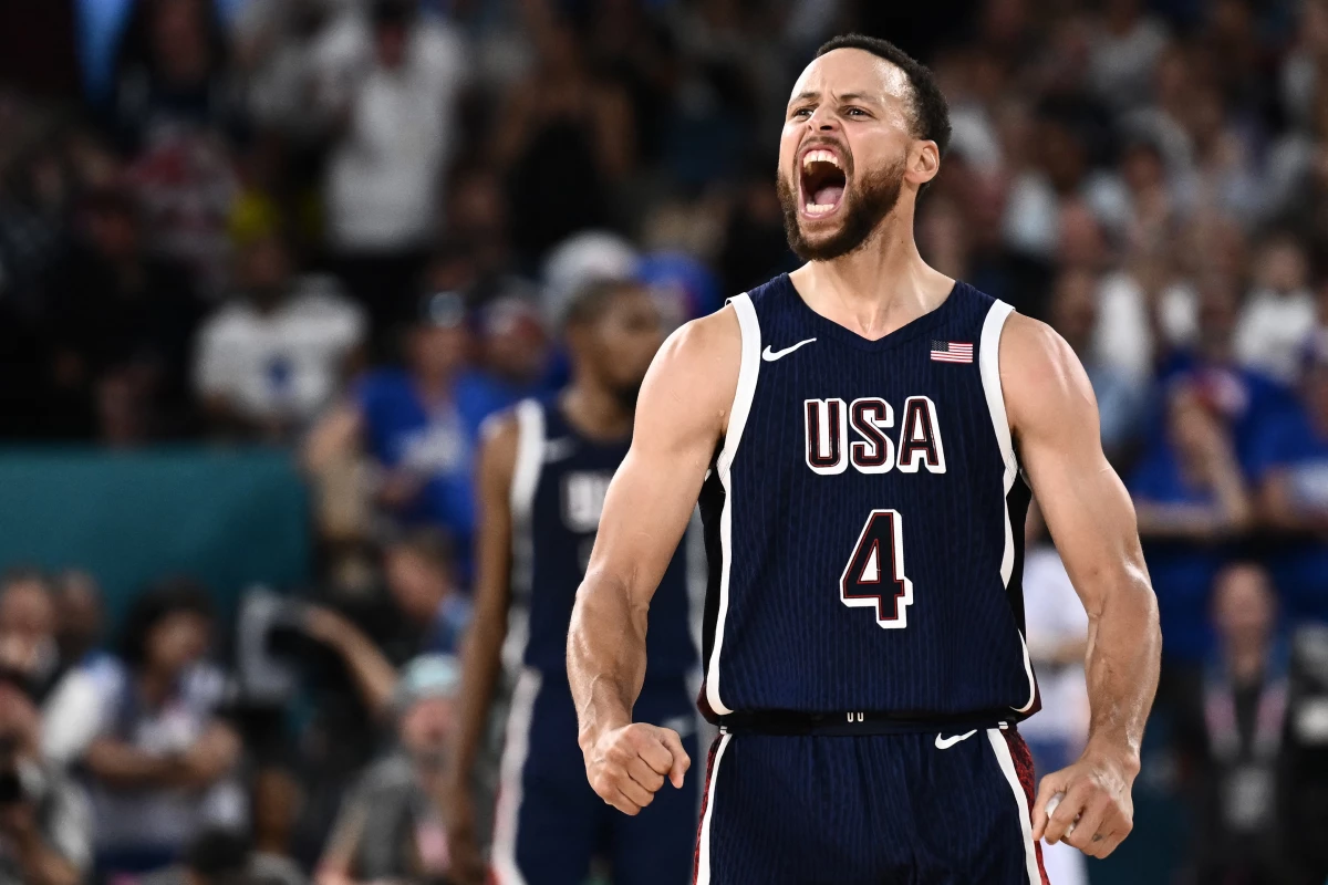 Steph Curry celebrates scoring a three-bucket during the U.S. game against France. The U.S. defeated the host country 98-87 to win its fifth-straight Olympic gold.