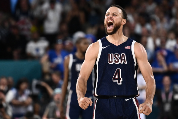 Steph Curry celebrates scoring a three-bucket during the U.S. game against France. The U.S. defeated the host country 98-87 to win its fifth-straight Olympic gold.