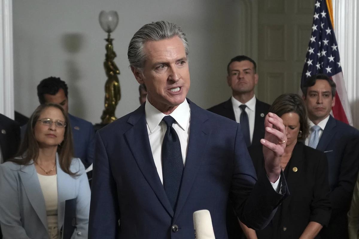 Accompanied by California and Texas lawmakers, California Gov. Gavin Newsom speaks in support of the Texas Democratic lawmakers for their walkout to block a vote on a congressional redistricting plan sought by President Donald Trump, during a news conference in Sacramento, Calif., Friday Aug. 8, 2025.