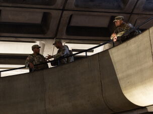 Members of the Army National Guard patrol Metro Center station during rush hour on July 08, 2026 in Washington, DC. The National Guard has been deployed in the city continuously for almost a year.