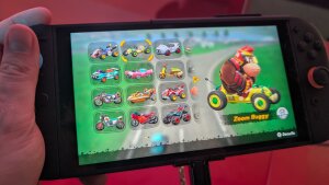 A Nintendo Switch 2 console playing Mario Kart World at a hands-on event in New York City.