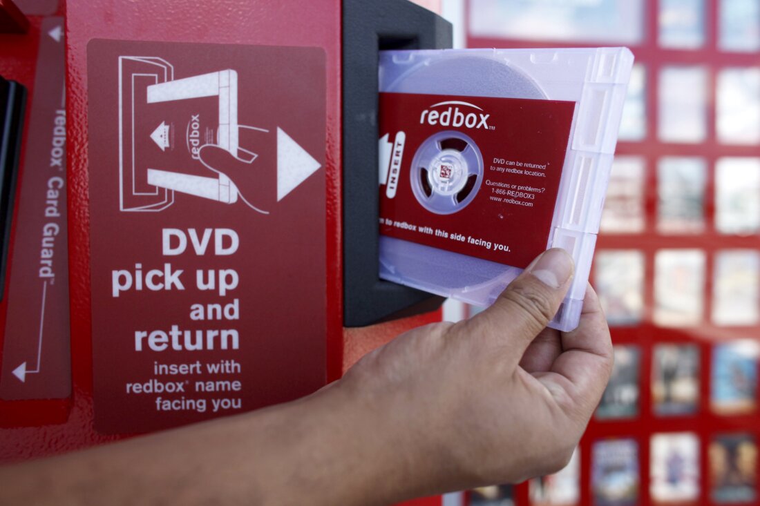 A rental DVD is dispensed from a Redbox at a 7-Eleven in Los Angeles in 2009. Chicken Soup for the Soul Entertainment, the owner of Redbox, filed for Chapter 11 bankruptcy protection on Friday.