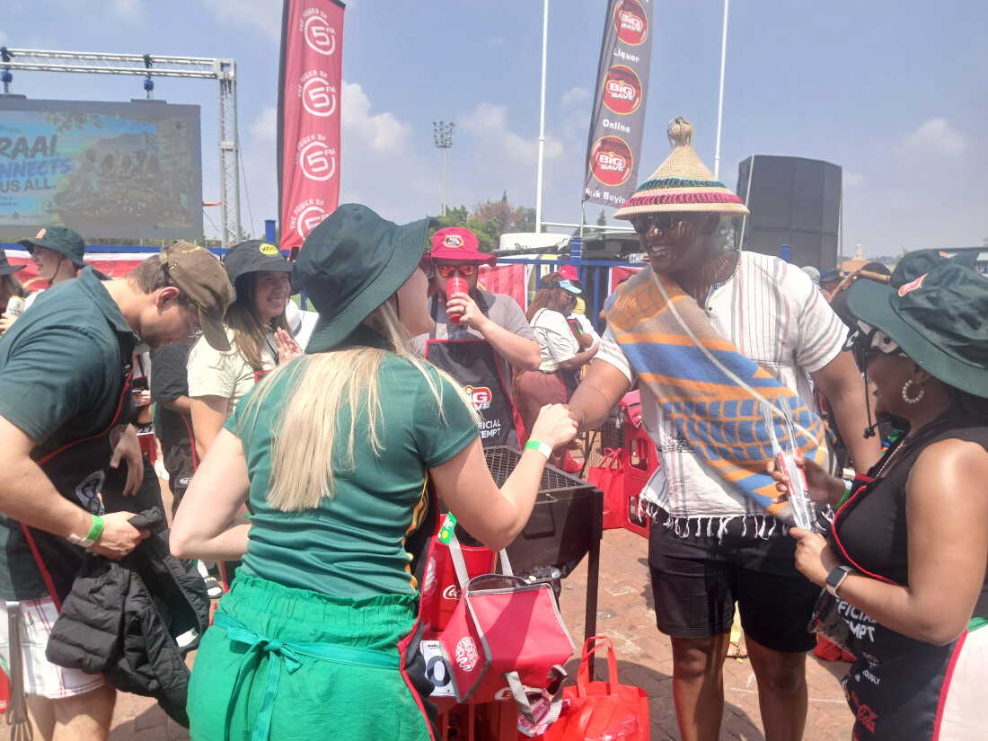Participants greet each other before starting the braaiing challenge.