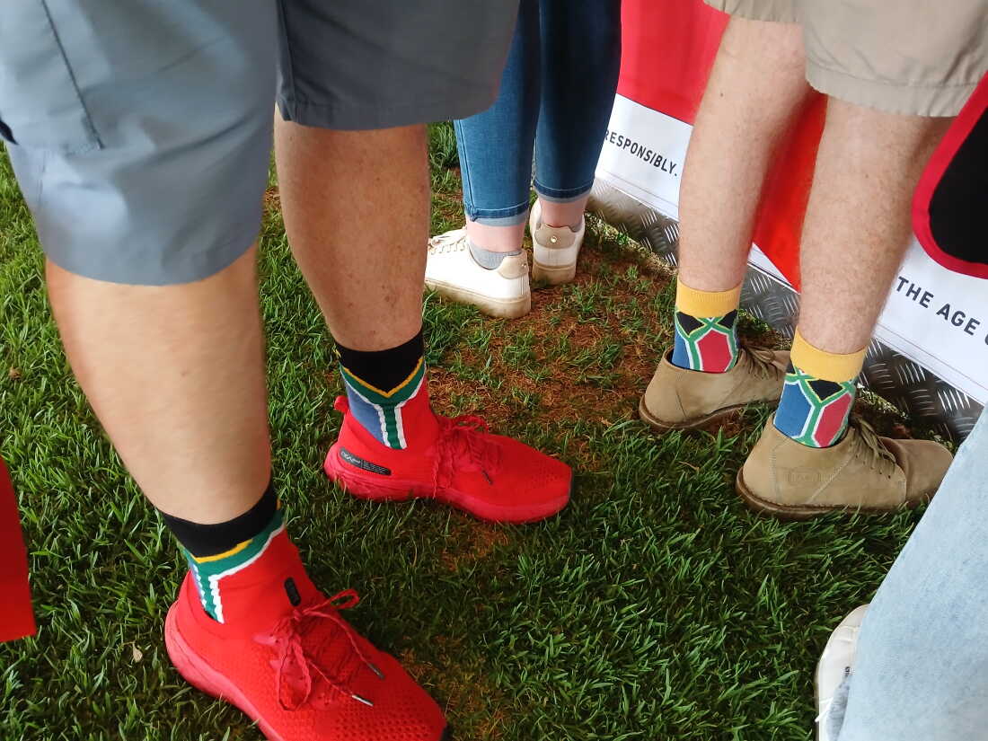 Participants at a braai challenge in Pretoria wear matching South African flag socks.