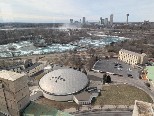 Aerial view of The Turtle with Niagara Falls beyond