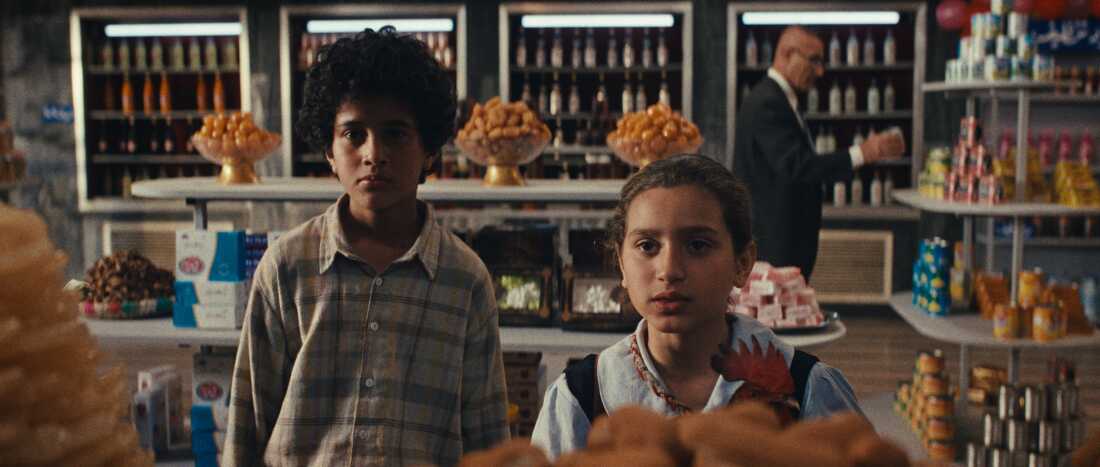 Sajad Mohamad Qasem, seen here at left, plays Lamia's best friend, Saeed.