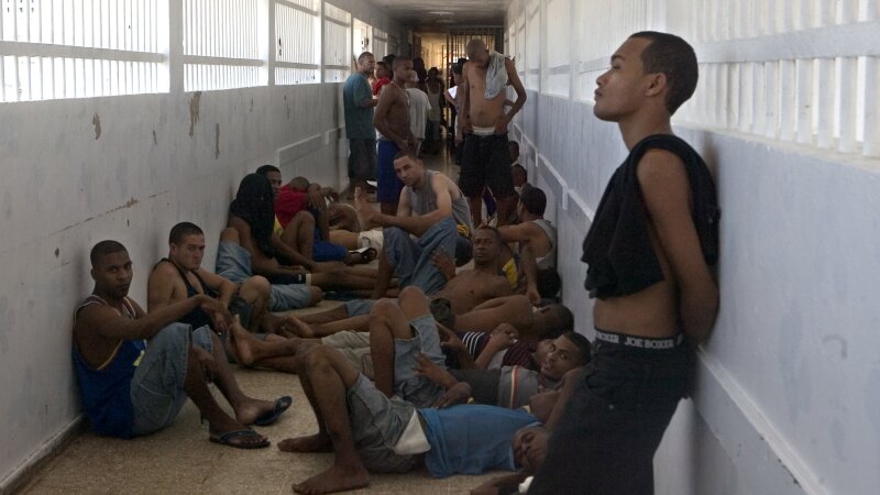 Inmates stand inside a corridor during time they are allowed to be outside of their cells at Najayo jail in San Cristobal, west of Santo Domingo in 2007.