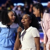 US actress Kerry Washington (C) teaches the public how to pronounce