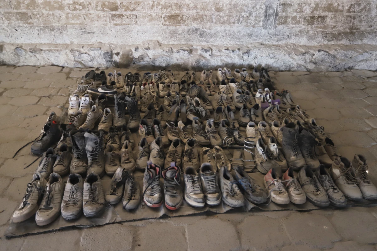 This photo released by the Jalisco State Attorney General's Office shows shoes at the Izaguirre Ranch where skeletal remains were also discovered in the municipality of Teuchitlan, Mexico on Tuesday.