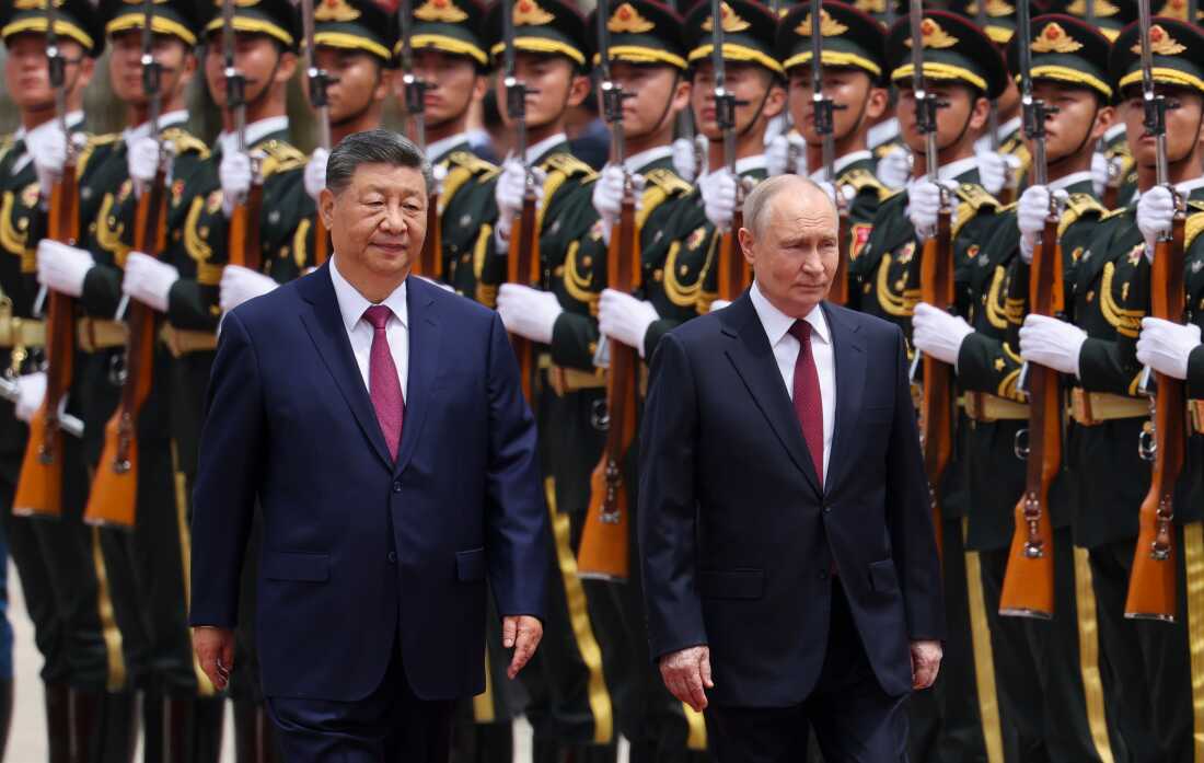 Russian President Vladimir Putin, right, and Chinese President Xi Jinping inspect an honor guard during a welcoming ceremony at the Great Hall of the People in Beijing Wednesday, May 20, 2026.