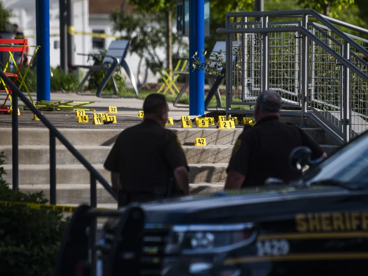 Officials with the Oakland County Sheriff's Department, Rochester Hills Fire Department and other jurisdictions secure the scene of a shooting at the Brooklands Plaza Splash Pad, Saturday, June 15, 2024, in Rochester Hills, Mich.