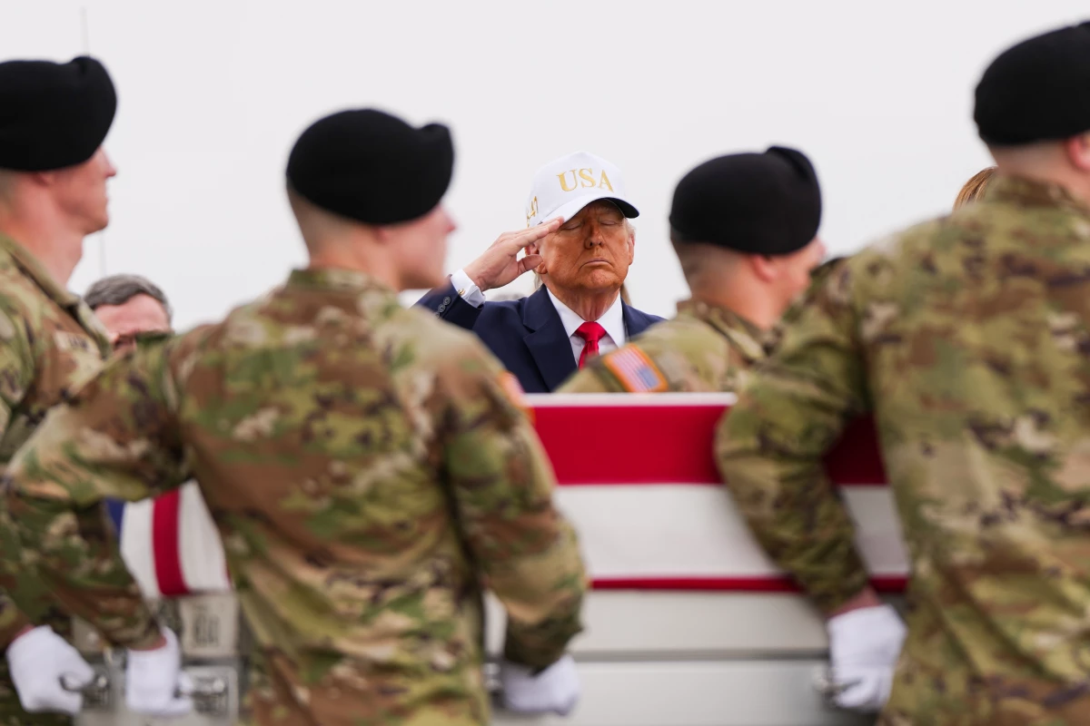 March 7: President Trump salutes as an Army carry team at Dover Air Force Base in Delaware moves a flag-draped transfer case with the remains of Sgt. Declan Coady, 20, of West Des Moines, Iowa. Coady was killed in a drone strike at a command center in Kuwait after the U.S. and Israel launched a military campaign against Iran.