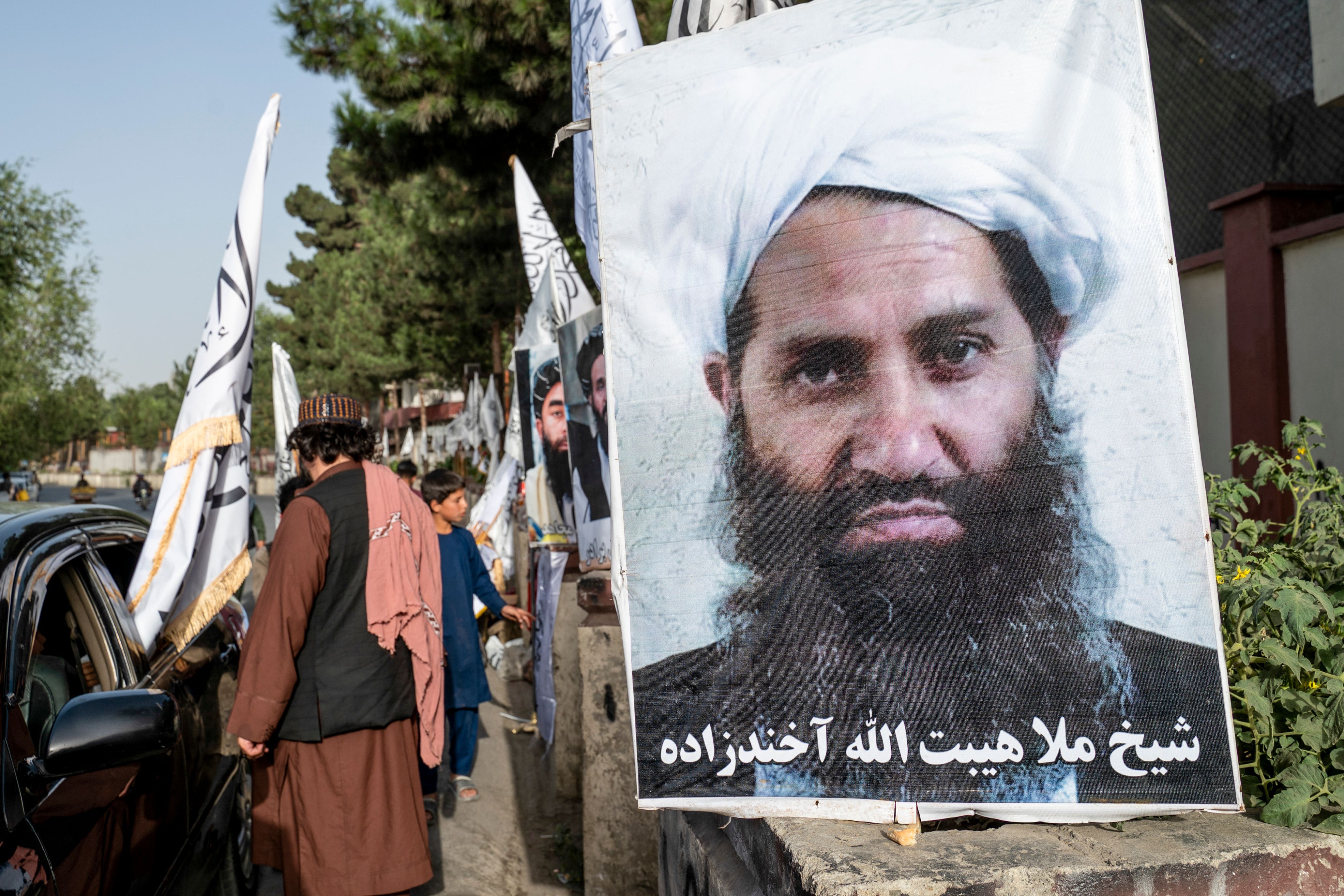 A poster of Taliban Supreme Leader Hibatullah Akhundzada is seen along a road in Kabul. He is one of two leaders named in proposed arrest warrants for their treatment of girls and women since taking power in 2021.