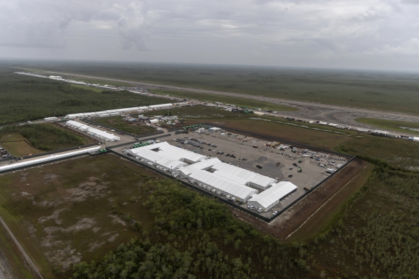 In an aerial view from a helicopter, the migrant detention center, dubbed "Alligator Alcatraz," is seen located at the site of the Dade-Collier Training and Transition Airport on July 4, 2025 in Ochopee, Fla. The 5,000-bed facility is located at a rarely-used airfield in the Everglades wetlands, as part of the Trump administration's expansion of undocumented migrant deportations.