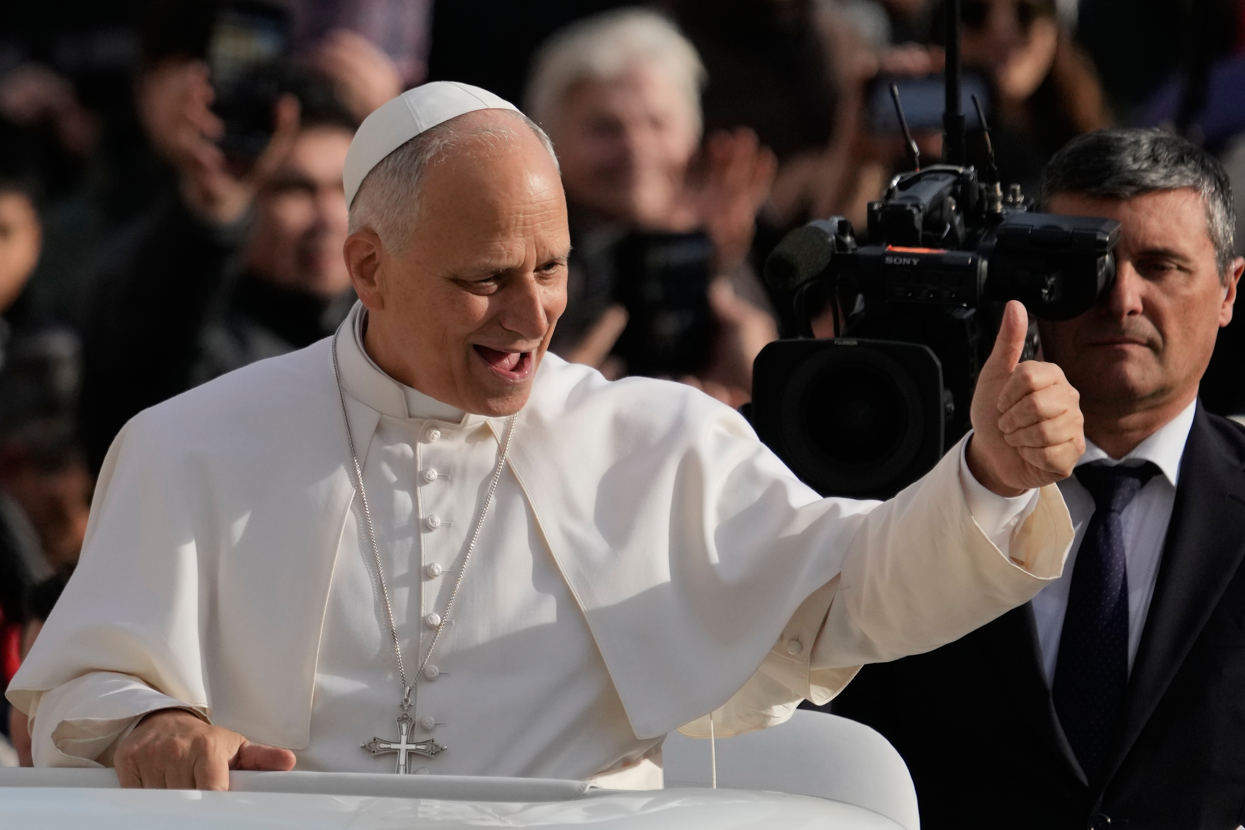 Pope Leo XIV greets faithful as he arrives in St. Peter