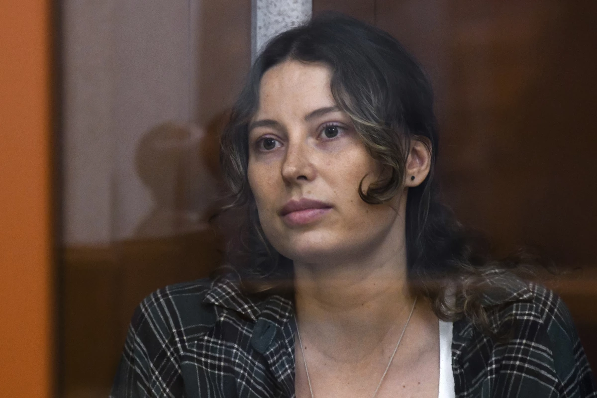 Ksenia Karelina, also known as Khavana sits in a glass cage in a court room in Yekaterinburg, Russia, Thursday, June 20, 2024.