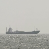 A vessel is anchored off the coast of Sharjah in the United Arab Emirates on Aug. 3. The war with Iran nearly ground traffic to a halt in the Strait of Hormuz.