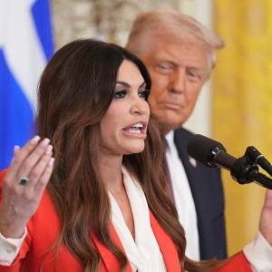 FILE - Kimberly Guilfoyle speaks as President Donald Trump listens at a reception celebrating Greek Independence Day in the East Room of the White House, March 24, 2025, in Washington.