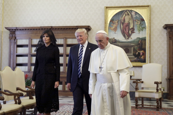 Pope Francis walks with President Trump and first lady Melania Trump during a private audience at the Vatican on May 24, 2017.