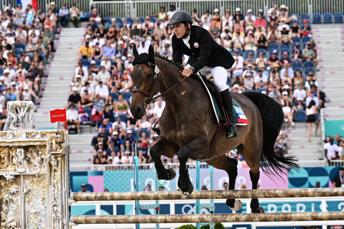 Chile's Esteban Bustos competes in the men's riding show jumping of the modern pentathlon during the Paris 2024 Olympic Games at the Chateau de Versailles in Versailles on Friday. The equestrian portion of the Olympic modern pentathlon will end after these Games — replaced with ...