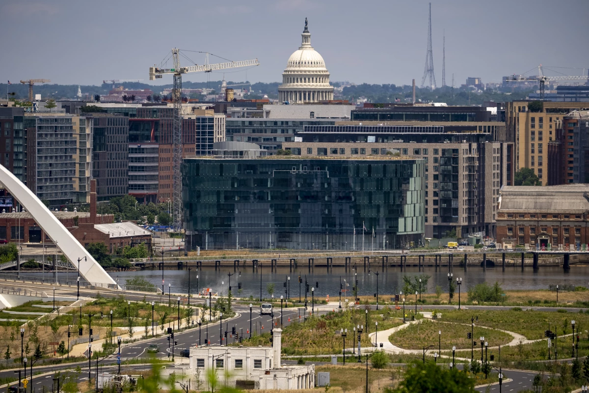 The newly built DC Water Headquarters across the Anacostia River and the Dome of the U.S. Capitol Building are visible from the Department of Homeland Security's St. Elizabeths Campus in Washington, Thursday, June 15, 2023.