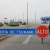 A traffic police officer in Peru sets up a roadblock during a tsunami warning in La Punta, Callao province on July 30, 2025. Alerts were issued in countries across the Pacific, following a massive 8.8-magnitude earthquake off the east coast of Russia.