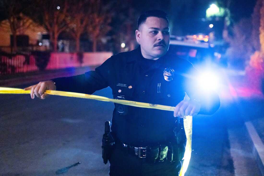 A police officer blocks off a street near Rob Reiner's residence Sunday, Dec. 14, 2025, in the Brentwood section of Los Angeles.
