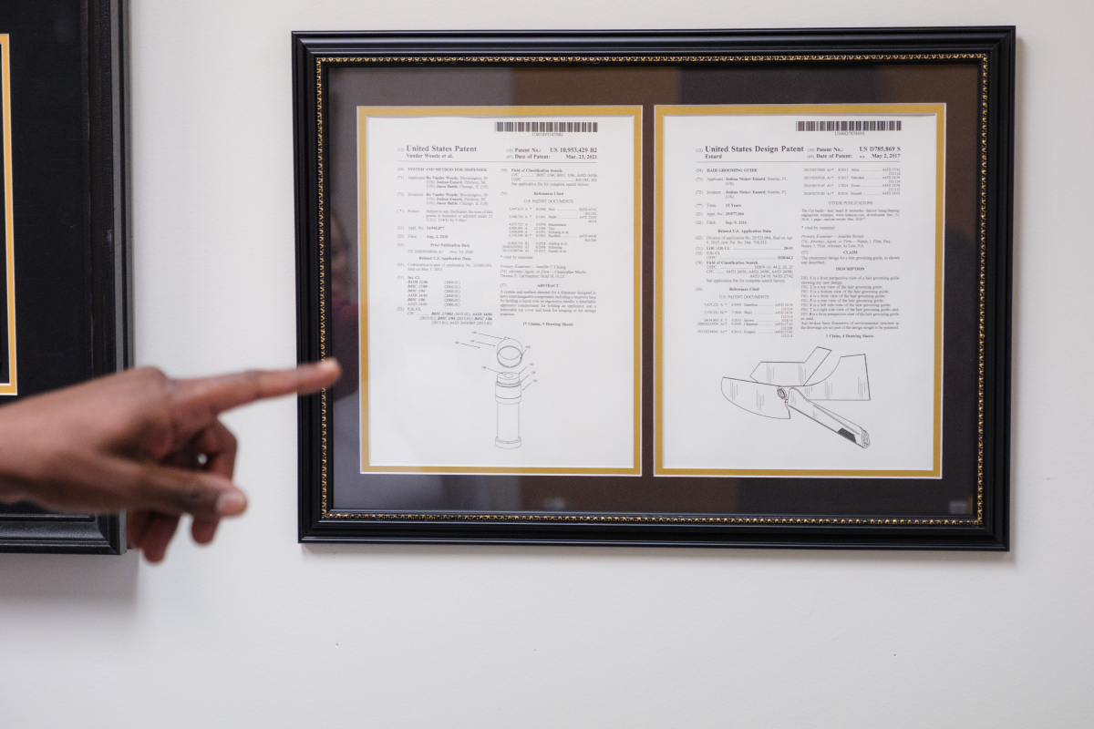 Esnard's office walls are lined with patents, including one for a version of his tool to guide hair trims.