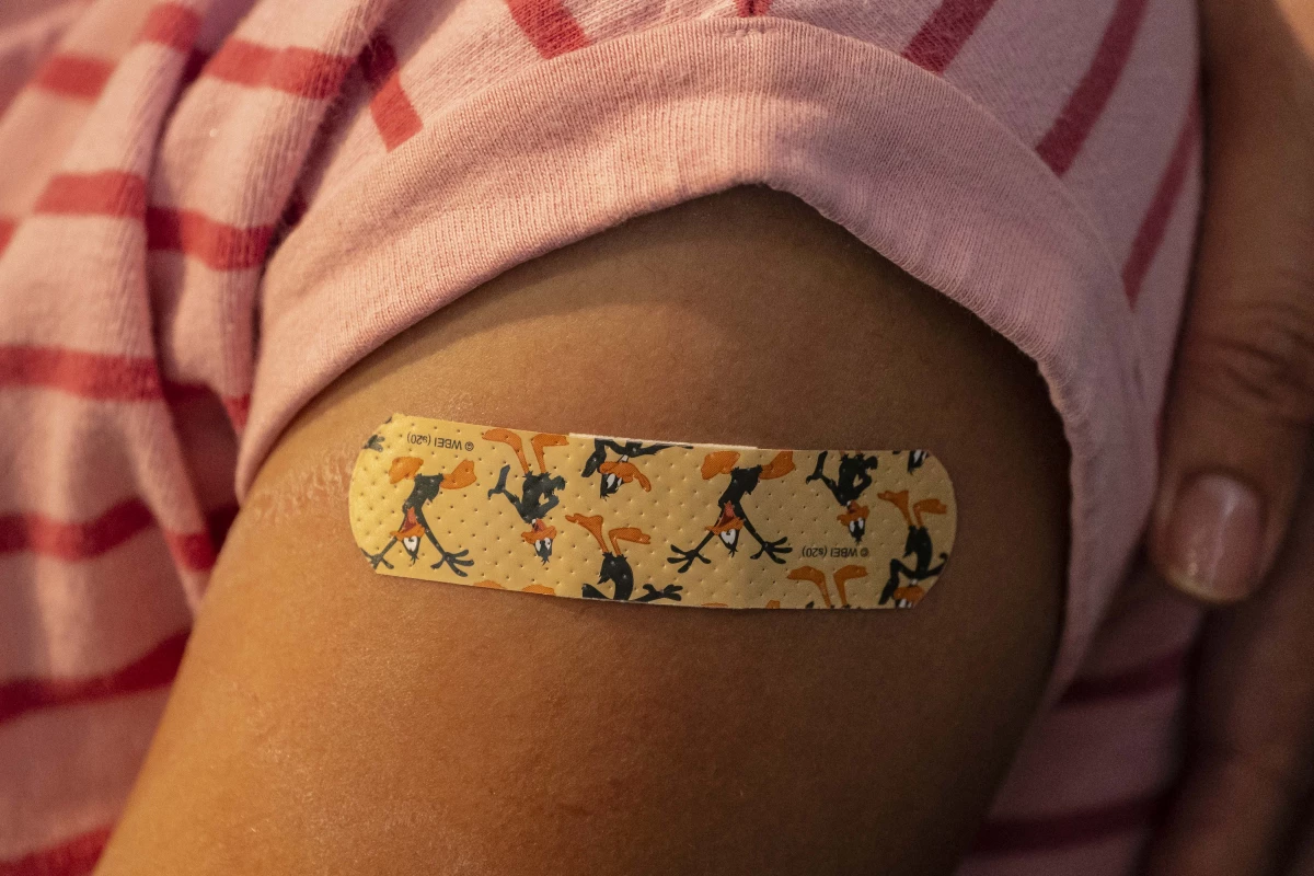A bandage is seen on a child's arm after she received a COVID vaccine on November 3, 2021 in Shoreline, Washington.