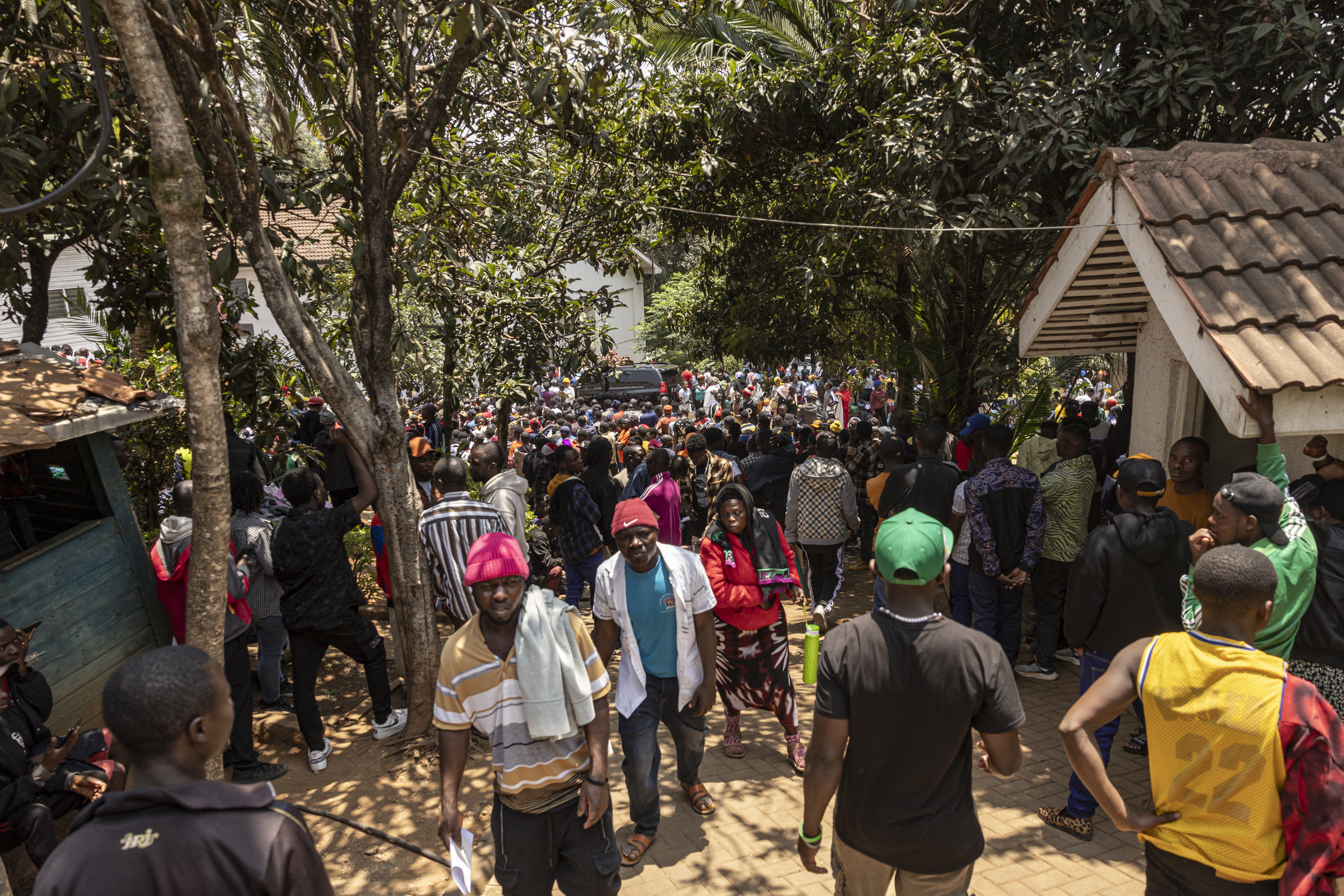 Burundian nationals queue outside their embassy in Nairobi to obtain travel documents, amid uncertainty following Kenya