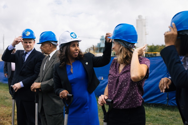 Chelsea Andrews (white hat), president and executive director of Montgomery County's Housing Opportunities Commission, adjusts Maryland State Delegate Lorig Charkoudian's hardhat during a groundbreaking ceremony for the Hillandale Gateway housing development in Silver Spring, Md. The HOC says it owns more than 9,400 apartment, townhome and single-family home rental properties and provides subsidized housing for more than 9,300 households.