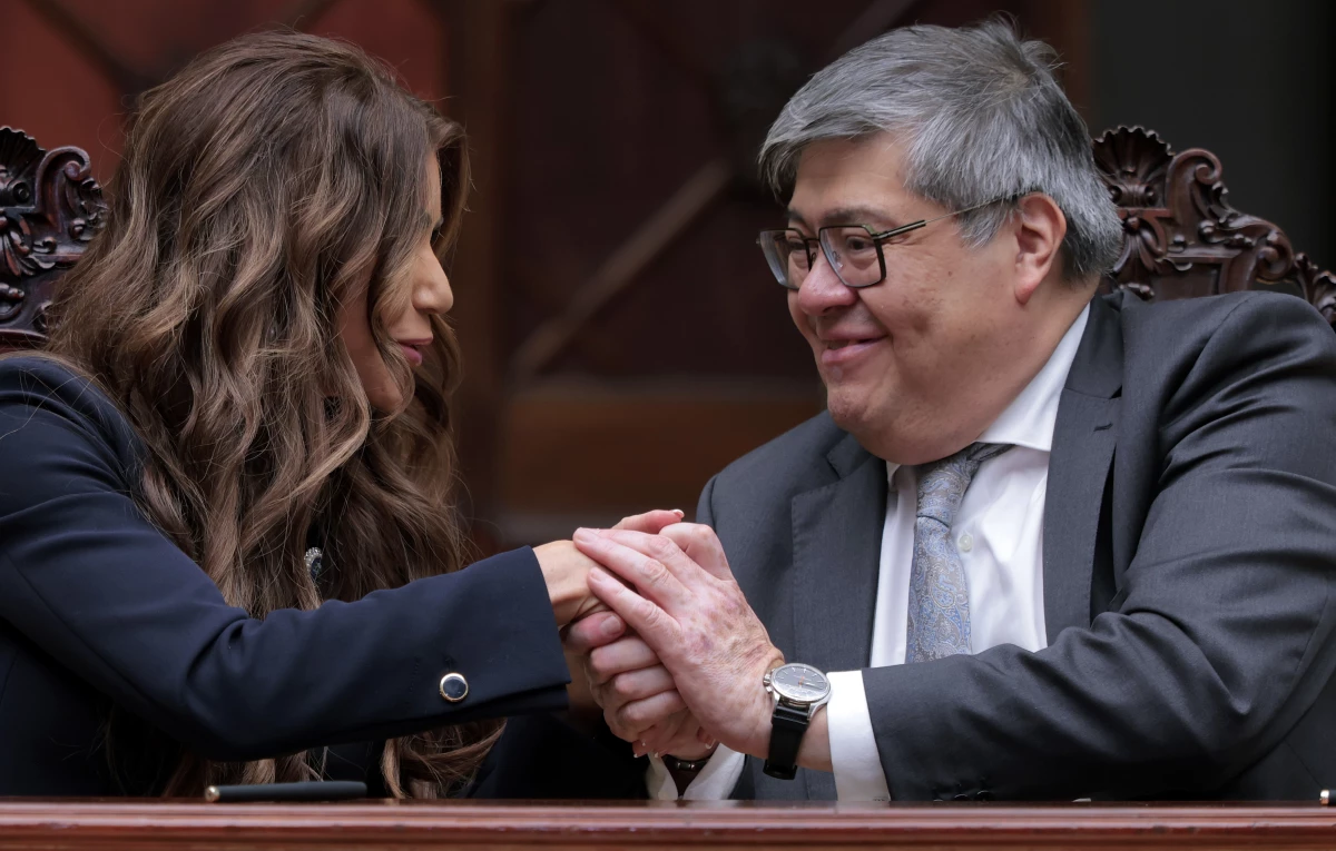 Homeland Security Secretary Kristi Noem and Guatemalan Minister of Governance Francisco Jimenez shake hands after signing a memorandum of understanding on a joint security program agreement at the Palacio Nacional de la Cultura on June 26 in Guatemala City, Guatemala.